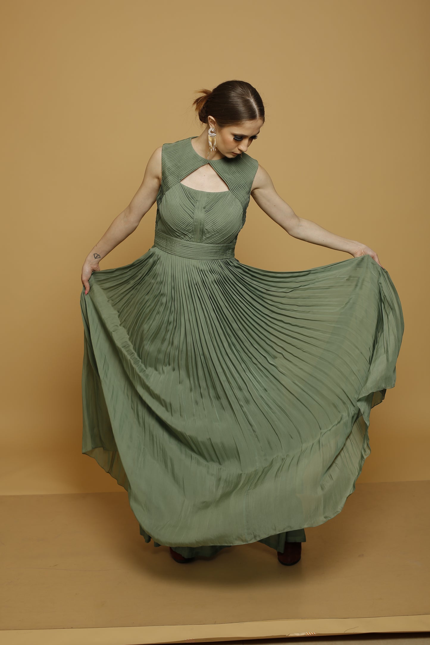 Sleeveless pleated gown