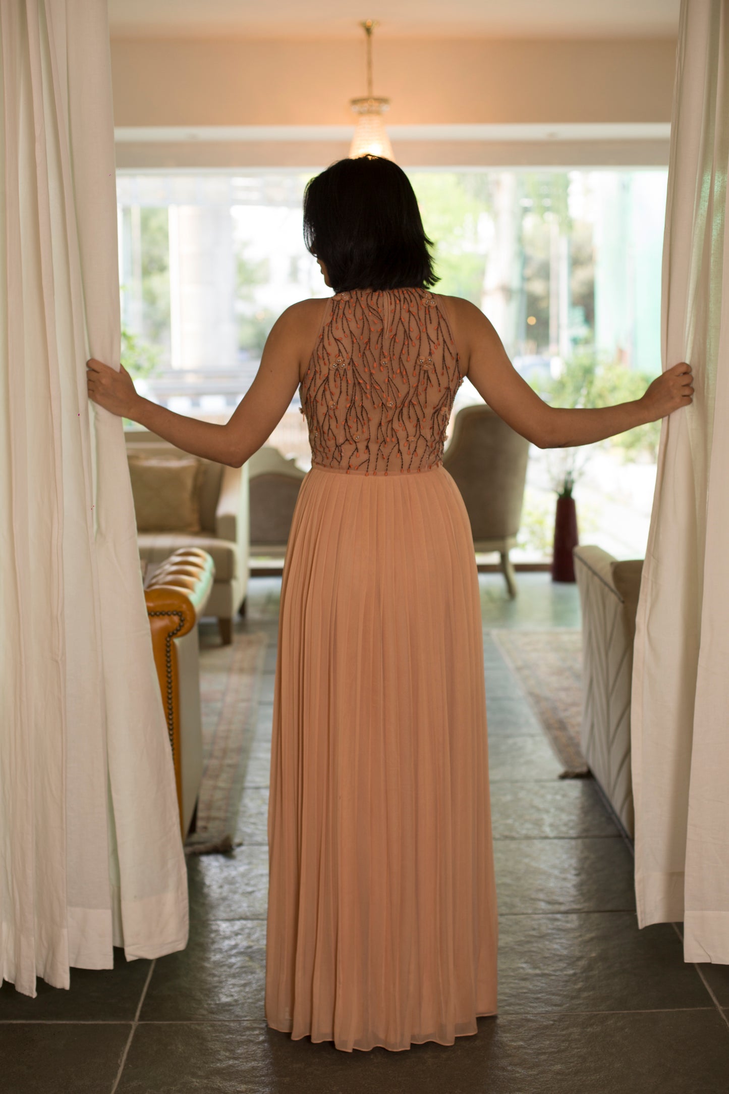 Embroidered pleated gown
